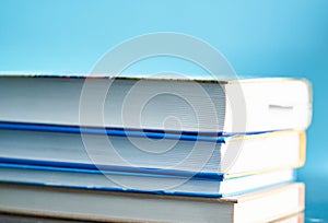 Glasses lie on a stack of books, science