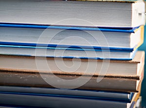 Glasses lie on a stack of books, science