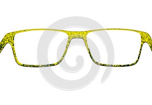 Glasses made of yellow flower isolated on white background photo