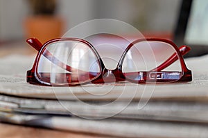 Glasses on newspaper