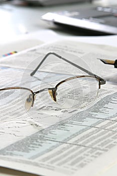 Glasses on a newspapper photo