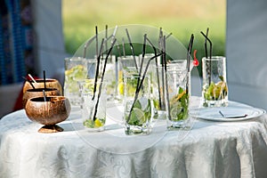 Glasses of non-alcoholic mojito on the buffet table. concept is a party. Creative subjects for design and illustrations of drinks