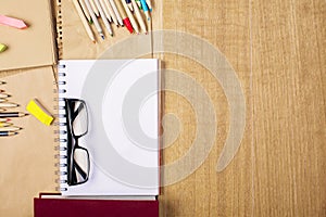 Glasses, notepad and pencils