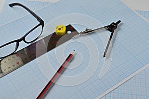 Glasses and objects for drawing on millimeter paper.