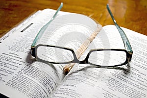 Glasses on Open Bible