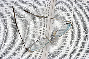 Glasses on opened book