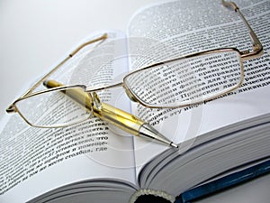 Glasses & pen on book 2