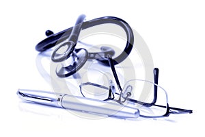 Glasses, a pen and stethoscope
