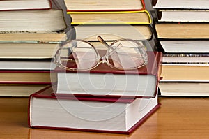 Glasses on a pile of books