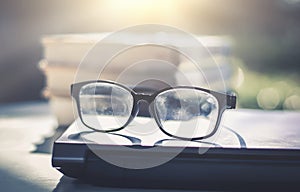 Glasses placed on the laptop in the library.