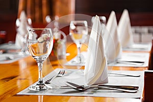 Glasses and plates on table in restaurant