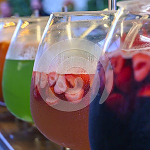 Glasses with punch of various colorful and fruits