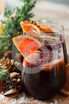 Glasses of punch for winter and Christmas with fruits and wine