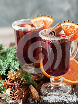 Glasses of punch for winter and Christmas with fruits and wine
