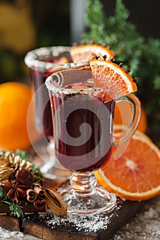 Glasses of punch for winter and Christmas with fruits and wine