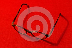 Glasses on a red background