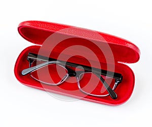 Glasses in red case on a white background