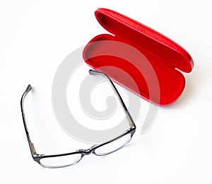 Glasses and red case on a white background