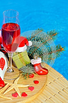 Glasses with red champagne and Christmas decor