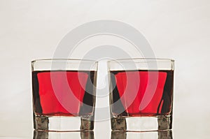 glasses with red drink/glasses with red drink on a white background.