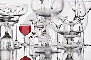 Glasses with red drink on a white background