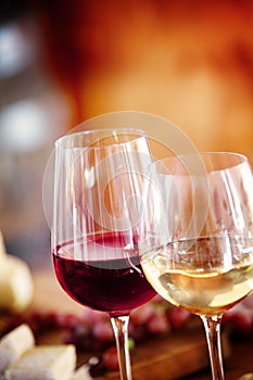 Glasses of red and white wine on a table