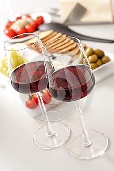 Glasses of red wine with appetiser