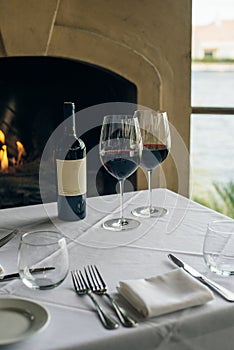 Glasses with red wine on bar counter in restaurante photo