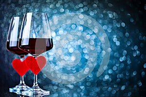 Glasses of red wine on a beautiful bokeh background. Background with copy space. Selective focus.