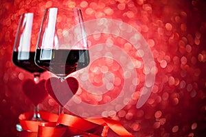 Glasses of red wine on a beautiful bokeh background. Background with copy space. Selective focus.