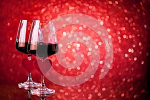 Glasses of red wine on a beautiful bokeh background. Background with copy space. Selective focus.