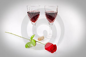 Glasses Of Red Wine With Cork And Rose