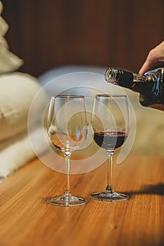 Glasses with red wine in a cozy apartment