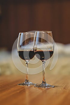 Glasses with red wine in a cozy apartment