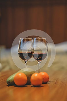 Glasses with red wine in a cozy apartment