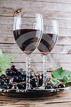 Glasses of red wine with grape