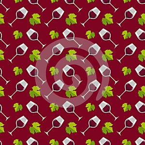 Glasses with red wine and green leaves of grapes on a red background.