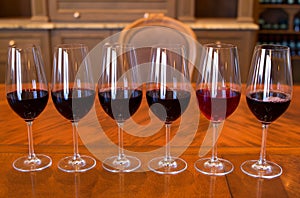 Glasses of red wine in a row