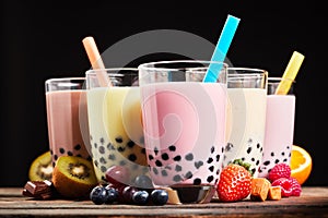 Glasses of refreshing milky boba or bubble tea photo