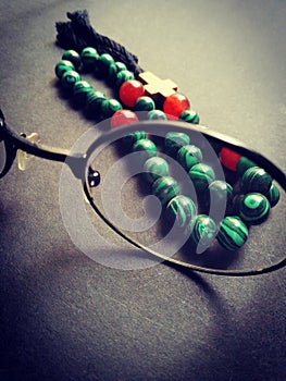 Glasses and rosary from malachite stone.