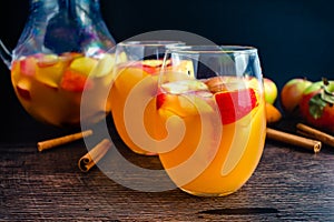 Glasses of Sangria With White Wine, Apples, Pears, and Cinnamon