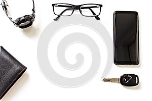 Glasses smart phone car key Watch wallet on the white background floor