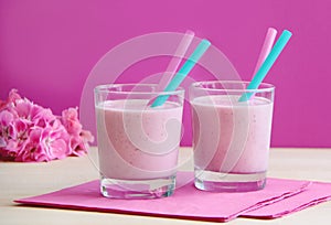 Glasses of strawberry milkshake. Healthy smoothie prepared as milk fruity cocktail.