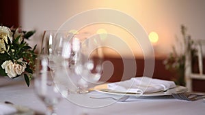 Glasses on a table at a restaurant. The restaurant`s interior. T