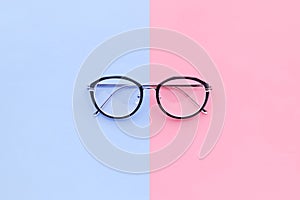 Glasses on two color pastel background.holiday concept