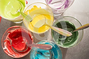 Glasses of various food coloring