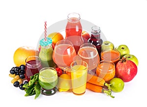 Glasses with various fresh vegetable juices on white