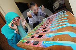 Glasses through which to view the phenomenon of solar eclipse.