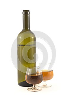 Glasses with wine and bottle isolated on white