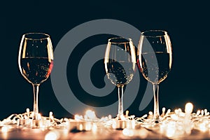 Glasses of wine and fairylights